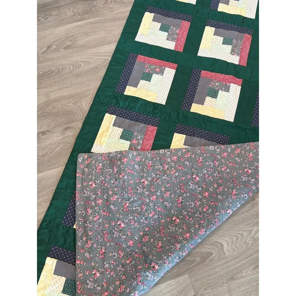 Vintage handmade log cabin quilt with green borders